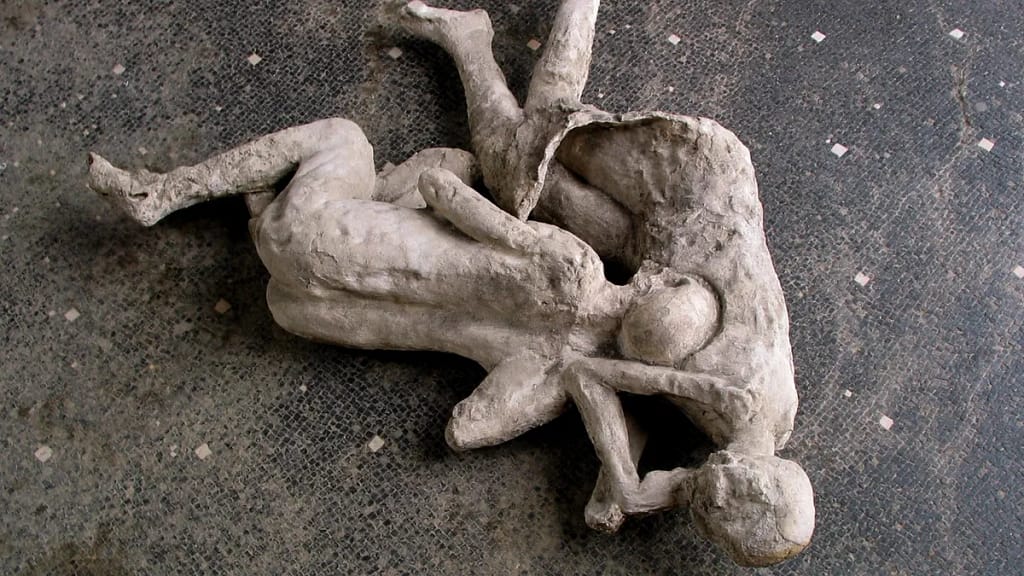 The casts of two individuals who perished in the cryptoporticus' home in Pompeii some 2,000 years ago. One person was identified as biologically male by a recent DNA examination, but the other's sex was unknown. (Photo courtesy of Pompeii's Archeological Park)
